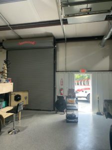 Rolling Steel Door Installed in Madison, Alabama by Overhead Door Company of Huntsville™/North Alabama™. A gray tall door with a new commercial operator attached.