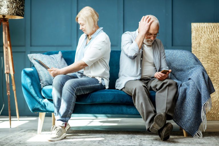 older couple trying to look up how to work on garage door