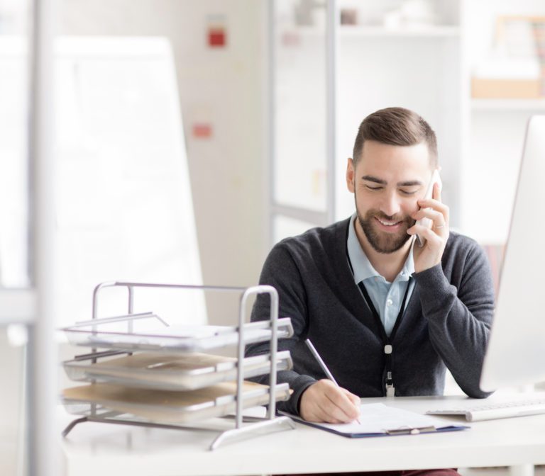 Man on phone scheduling