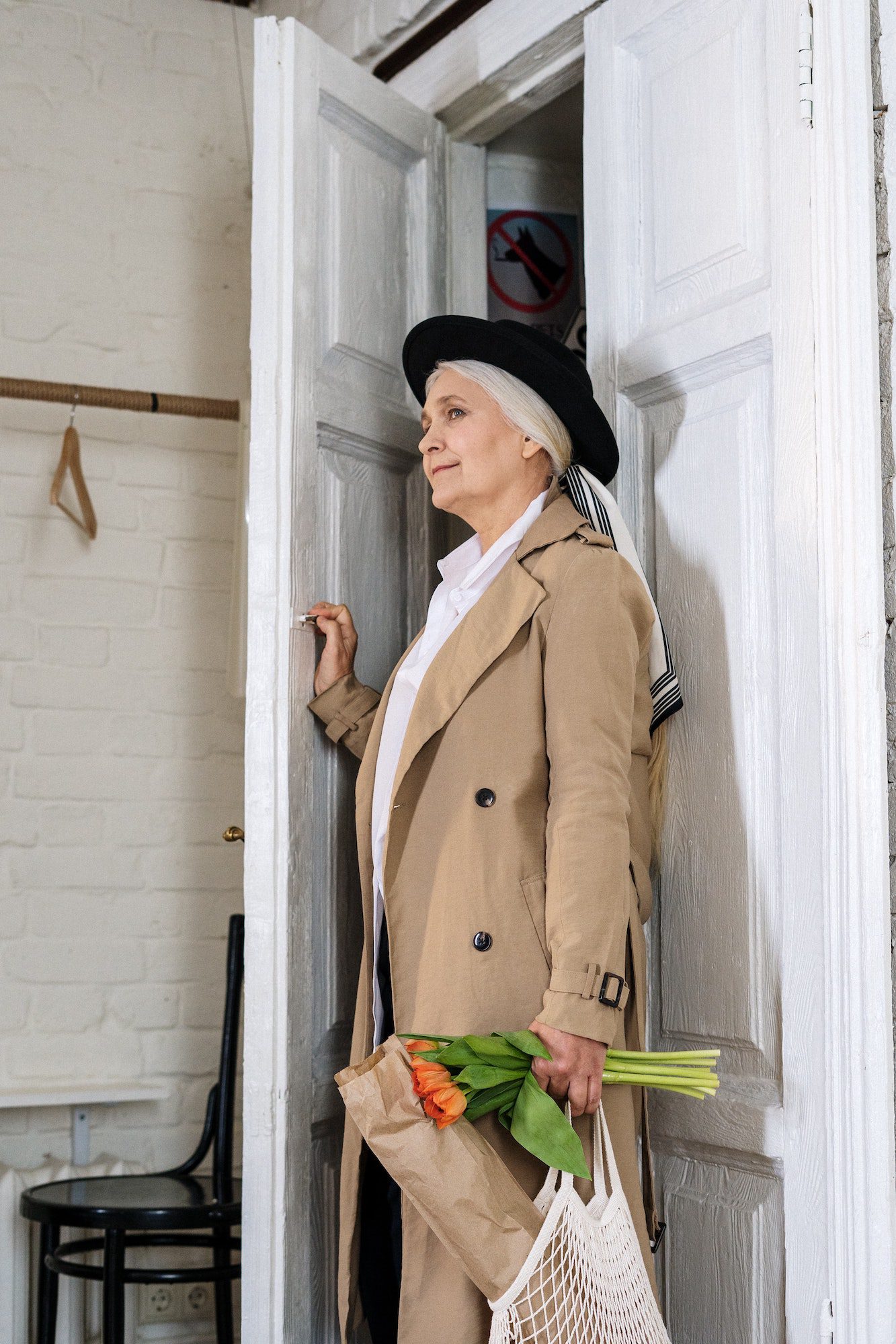 Lady walking into a garage at her home