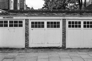 Three Old White Garage Doors from 1921. About tge history in the garage door industry. This was what the original garage doors looked like.