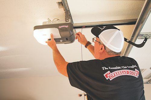 Garage Door Spring Repair. An Overhead Door Company of Huntsville technician makes sure the garage door repair is fixed quickly.