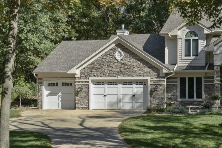 If you’re after the aesthetic of wood but need the strength of steel, this insulated steel garage doors in North Alabama are perfect for you. The ​​​​​​​​​​​​​​​​​​​​​​​​​​​​​​​​​​​​​​​​​​​​​​​​​​​​​​​​​​​​​​Courtyard Collection® offers the design details of classic carriage house-style doors and the built-in stability of modern construction. Boasting foamed-in-place polyurethane insulation, an R-value up to 12.76, and diverse design options, ​​​​​​​​​​​​​​​​​​​​​​​​​​​​​​​​​​​​​​​​​​​​​​​​​​​​​​​​​​​Courtyard Collection® insulated steel garage doors are perfect for any home. This pictures is of a door that is as described above. Pictured is a beautiful white Courtyard Style Garage Door