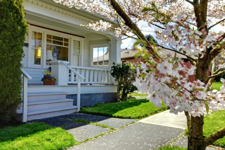 Lovely historical home located in Tanner, Alabama. Overhead Door Company has come to service a door on this old home. There is a pretty cherry tree blooming in front.